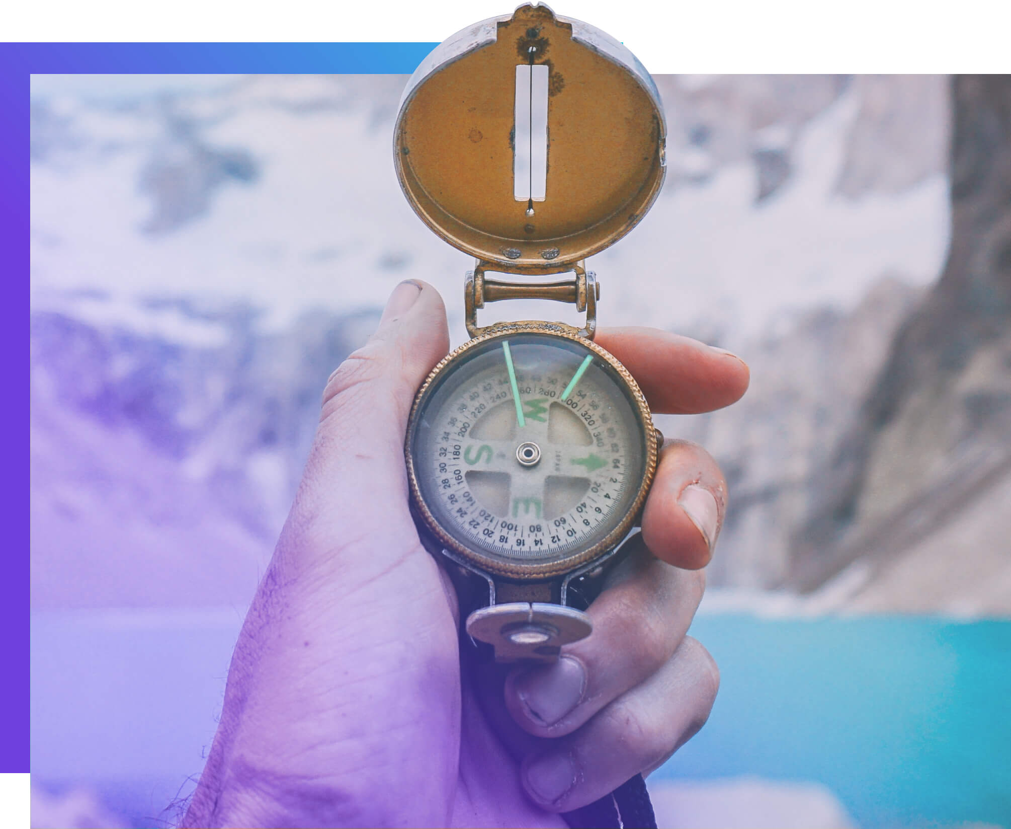 Photo of a person's hand holding a compass