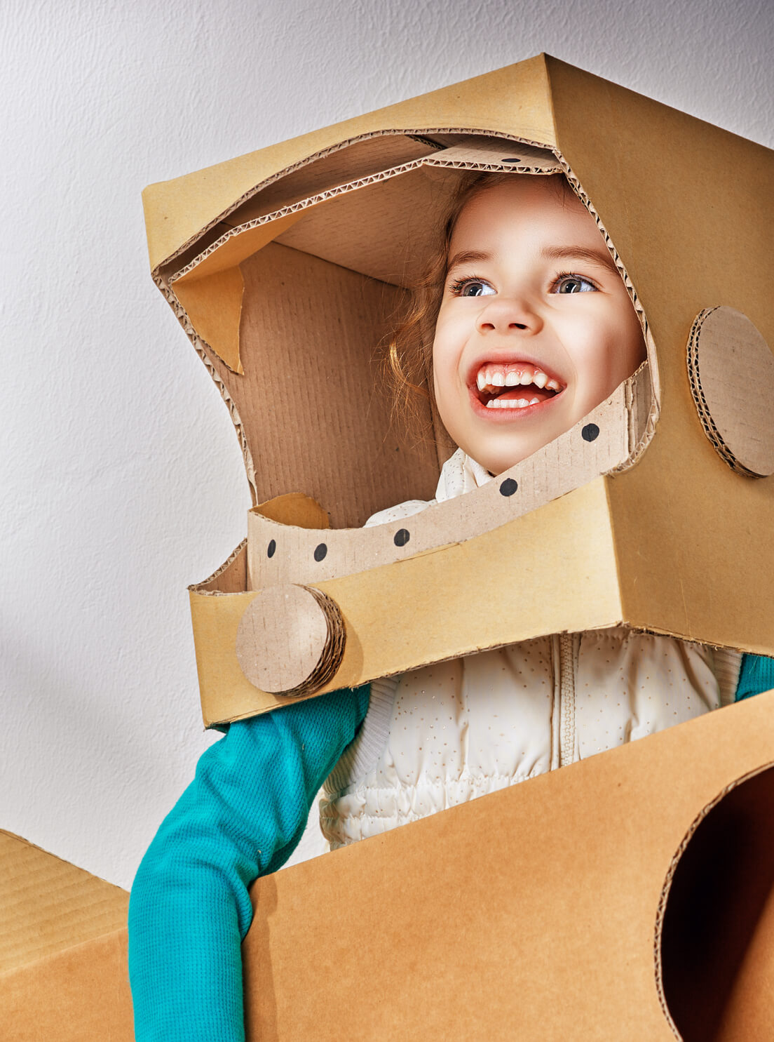 Photo of a boy in a costume made out of cardboard