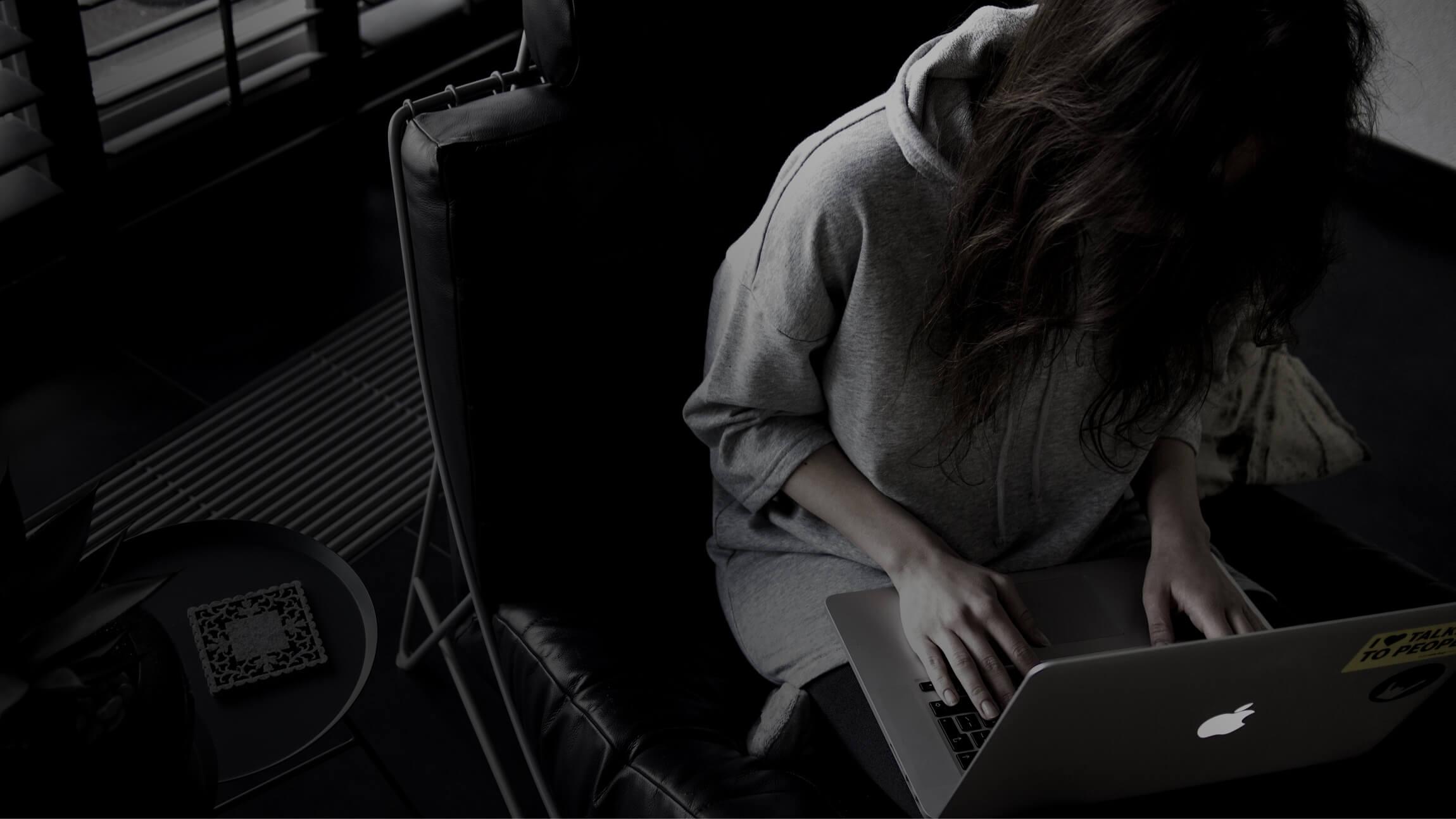 Photo of a woman working at a computer